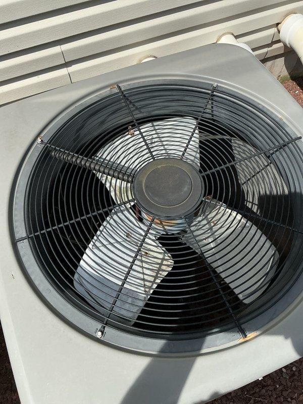 Responded to service call for downstairs HVAC unit that would not turn on. Upon arrival, found thermostat displaying "System: Wait" status, indicating a safety delay timer was active. Inspected 9-year-old heat pump system including outdoor condenser unit and indoor components. Replaced air filters on both upstairs and downstairs HVAC units as requested. Verified outdoor condenser unit fan assembly and protective guard were intact and functioning properly. System resumed normal operation after safety timer cycle completed.