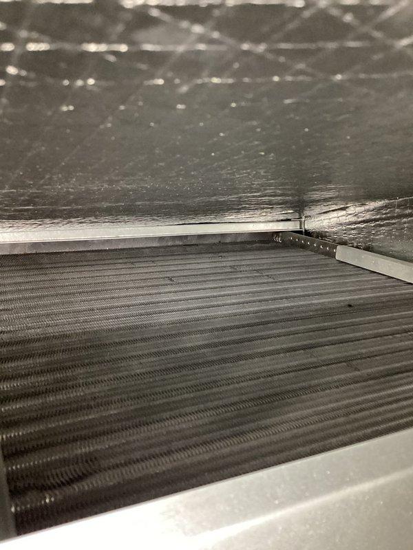 Completed comprehensive AC tune-up on two-zone system including second floor unit under membership plan and first floor Lennox heat pump installed in 2022. Performed standard maintenance procedures on both systems, inspecting condenser coils, blower wheel assemblies, and verifying proper operation of all components. Both units found to be in good working condition with normal dust accumulation on heat exchanger fins and clean blower wheel operation.