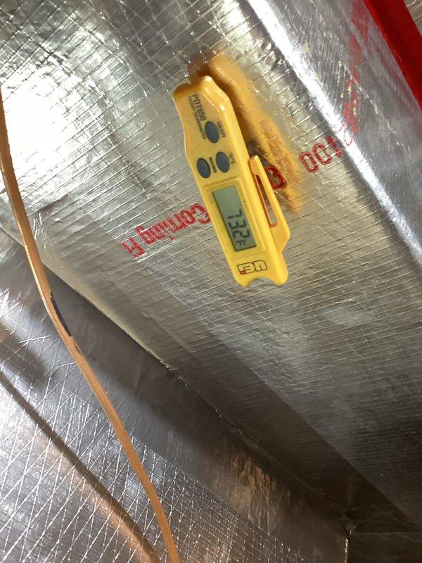 Responded to no cooling complaint with indoor fan and outdoor unit running but no cold air production. Performed diagnostic testing and measured supply air temperature at 88.8°F, confirming lack of cooling. Identified failed capacitor with discolored and deteriorated wiring connections. Replaced defective capacitor, verified proper electrical connections, and restored system to normal cooling operation.