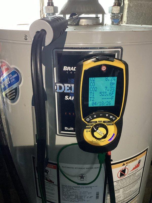 Responded to after hours emergency call for water heater complications. Upon arrival, performed comprehensive diagnostic assessment of residential gas-fired water heater system located in basement mechanical room. Utilized combustion analyzer to measure flue gas temperatures and CO2 levels, recording exhaust temperature of 523.6°F and CO2 reading of 7.3%. Tank surface temperature measured at 85.2°F. Inspection revealed water heater operating within normal parameters with proper venting through metallic ductwork. All safety labels and manufacturer specifications verified intact. System tested and confirmed operational with no immediate safety concerns identified.