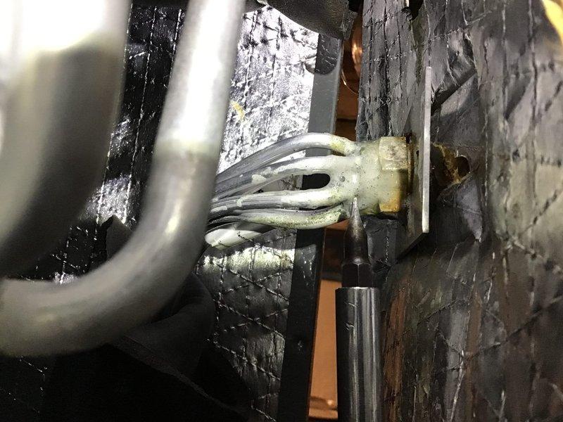 Completed comprehensive heat pump maintenance and system inspection on existing equipment. Performed heating mode tune-up including visual inspection of indoor air handler unit, ductwork connections, and electrical components. Verified proper operation of heat pump system while oil backup heating system was not serviced during this visit. Documented equipment condition with photographs showing basement installation environment and overall system configuration.