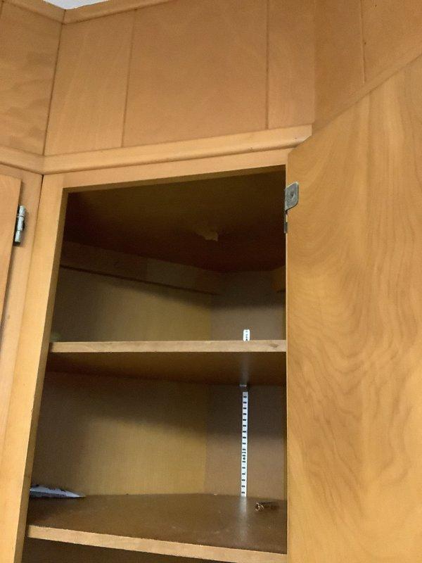 Responded to multiple plumbing issues including an upstairs shower with active leaking and drain leakage penetrating into the downstairs kitchen cabinet below. Inspected outdoor hose bibb with broken handle and evaluated the associated shut off valve for potential replacement or addition. Assessed indoor shut off valve on hose bibb from previous visit to determine if replacement is necessary. Documented conditions in basement utility area and affected kitchen cabinet for estimate preparation on shut off valve work.