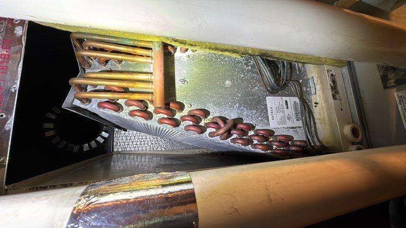 Completed comprehensive CPM air conditioning inspection including internal component evaluation, refrigerant line assessment, and evaporator coil examination. Cleaned burner tubes as requested and inspected acid neutralizer system to verify proper operation, confirming all components functioning within normal parameters.