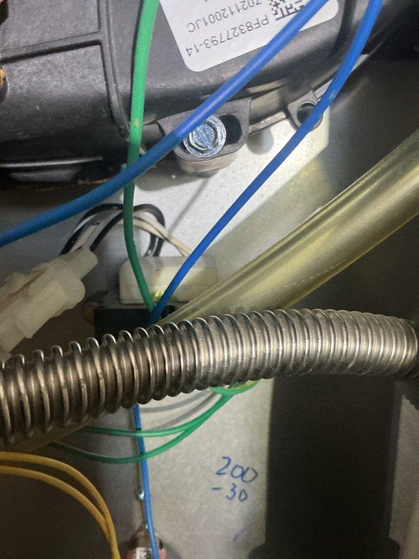 Responded to service call for propane furnace experiencing continuous humming noise. Upon inspection, accessed control panel and examined circuit board, wiring connections, and electrical components. Verified proper LED indicator function on control board and inspected all wire terminations including power, control, and safety circuit connections. Checked flexible conduit connections and assessed capacitor and relay components for proper operation. System evaluated and findings documented with photos of control board assembly and component wiring for reference.