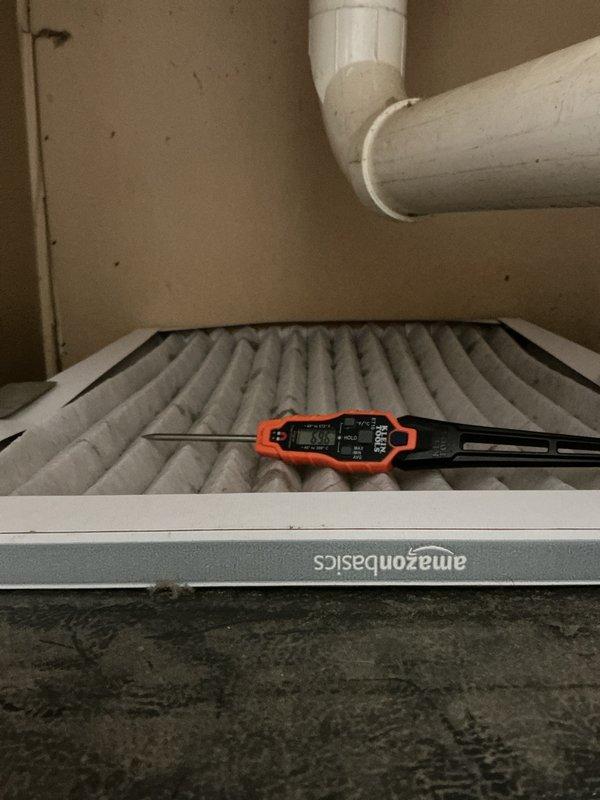 Completed comprehensive air conditioning tune-up and maintenance inspection for residential HVAC system that had not been serviced since 2018. Performed system diagnostics to address reported cooling efficiency concerns, including temperature differential measurements across the air handler unit. Inspected air filtration system, noting AmazonBasics pleated filter in place with moderate dust accumulation; verified proper filter installation and airflow pathway. Examined condensate drainage system including PVC piping configuration and drain pan, observing moisture staining and sediment deposits in collection tray indicating normal system operation but recommending periodic cleaning to prevent potential blockages. Evaluated all accessible air handler components within utility closet installation, confirming proper mounting and clearances for maintenance access. System operational at time of inspection with all major components functioning as designed.