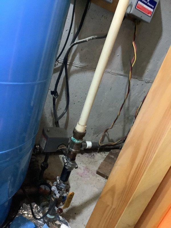 Responded to emergency call for rapidly accelerating leak in basement near well pressure tank system. Upon inspection, identified significant corrosion on existing plumbing infrastructure including pressure tank connections, valves, and associated fittings. Addressed immediate leak to prevent further water damage and system failure. Due to advanced age and deterioration of components, recommended complete system replacement including pressure tank, pressure switch, pressure gauge, relief valve, and shut-off valves. Documented existing conditions with photographs showing corroded piping, compromised connections, and overall system condition. Provided quote for comprehensive replacement of well tank package and associated components to be completed at later scheduled appointment.