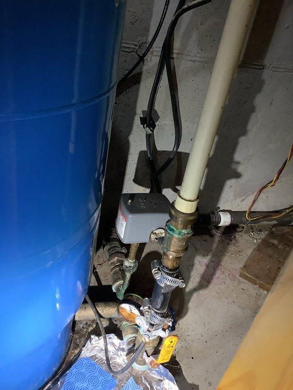 Responded to emergency call for rapidly accelerating leak in basement near well pressure tank system. Upon inspection, identified significant corrosion on existing plumbing infrastructure including pressure tank connections, valves, and associated fittings. Addressed immediate leak to prevent further water damage and system failure. Due to advanced age and deterioration of components, recommended complete system replacement including pressure tank, pressure switch, pressure gauge, relief valve, and shut-off valves. Documented existing conditions with photographs showing corroded piping, compromised connections, and overall system condition. Provided quote for comprehensive replacement of well tank package and associated components to be completed at later scheduled appointment.