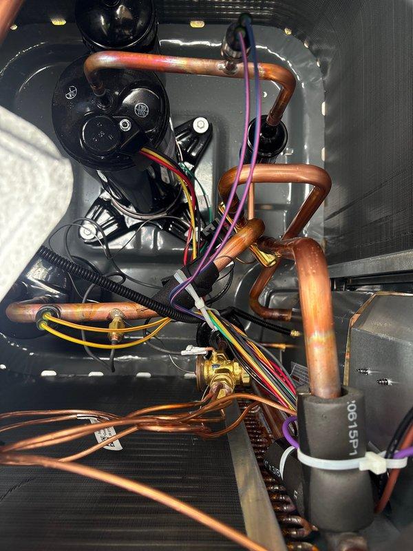 Completed full HVAC system change-out, installing a Moyer Comfort Series heat pump with ivory slim duct configuration at residential property. Installation included outdoor condenser unit mounted near brick exterior wall with weatherproof electrical disconnect, complete refrigerant line set with proper brazing and insulation, and all necessary electrical connections. System was tested and confirmed operational upon completion.