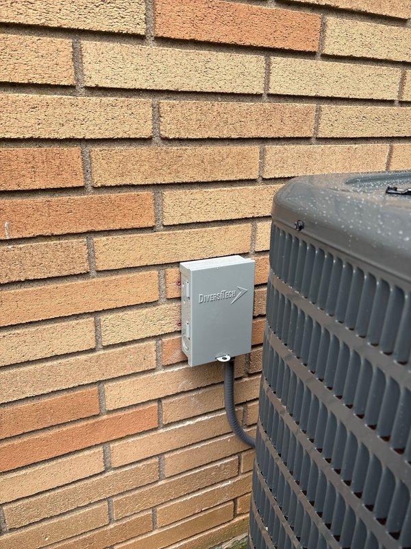 Completed full HVAC system change-out, installing a Moyer Comfort Series heat pump with ivory slim duct configuration at residential property. Installation included outdoor condenser unit mounted near brick exterior wall with weatherproof electrical disconnect, complete refrigerant line set with proper brazing and insulation, and all necessary electrical connections. System was tested and confirmed operational upon completion.