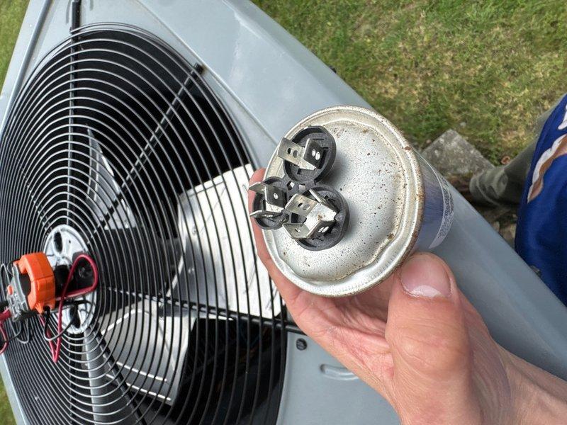 Responded to no cooling complaint on Daikin AC system installed in November 2023. Upon arrival, confirmed indoor unit fan operating continuously but outdoor condenser unit not running, resulting in thermostat reading 78°F despite setpoint of 69°F. Diagnosed failed capacitor on outdoor unit. Removed and replaced defective capacitor, restoring proper operation to condenser unit and cooling function to system.