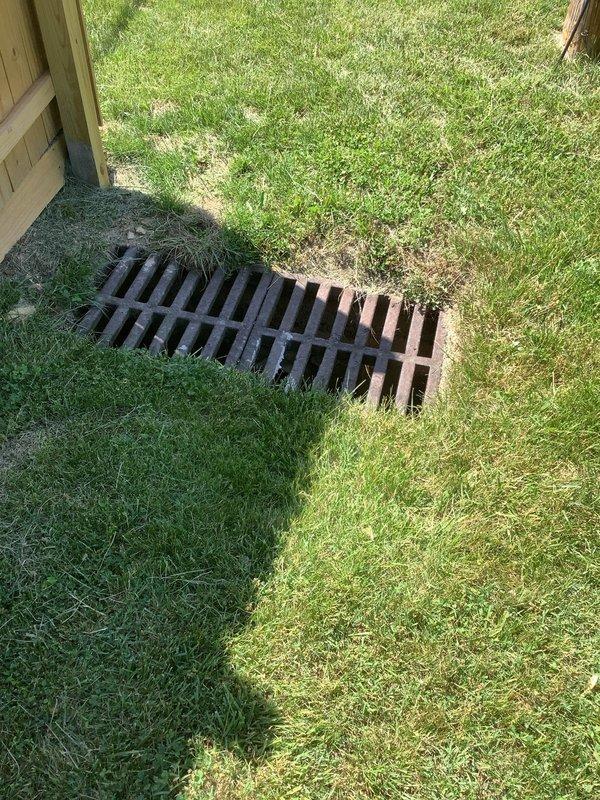 Responded to service call for broken sewer line located approximately 100 feet from main property structure on right-of-way easement with landowner authorization. Performed initial site assessment and documentation of affected area. Utility markings were observed on lawn indicating underground line locations, and drainage grate was inspected near wooden deck structure. Provided diagnostic evaluation and pricing estimate for sewer line repair, with customer understanding that full repair scope would be determined upon further investigation of break location and extent of damage.