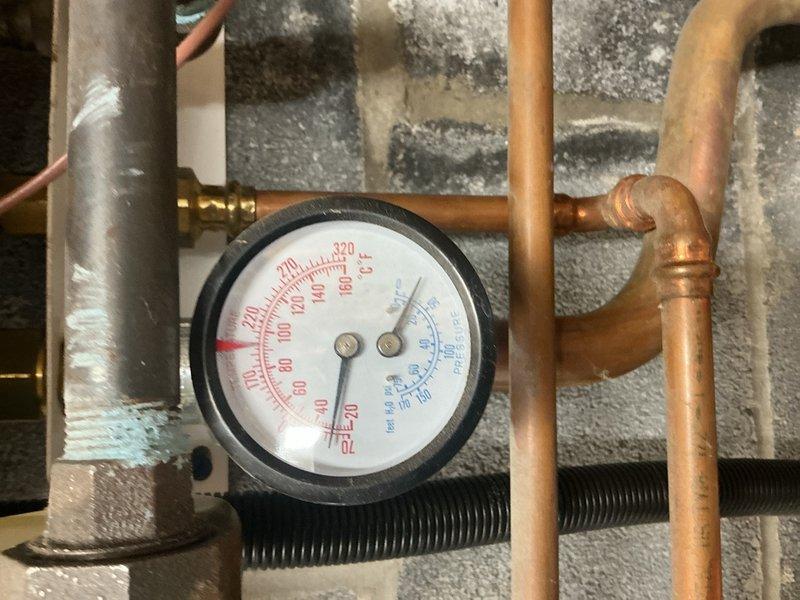 Responded to no hot water complaint on Triangle Tube propane combi boiler system displaying error code E18. Diagnosed faulty control board and replaced PCB component to restore proper operation. System tested and confirmed operational with appropriate pressure readings and hot water production restored.