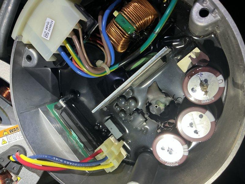 Responded to customer report of strange odor and short cycling from outdoor unit. Upon arrival, performed comprehensive preventive maintenance inspection on Rheem heat pump system installed in 2017. Inspected blower motor assembly, verified electrical connections and wiring integrity on motor terminal block. Examined internal components including capacitors, inductor coil, and circuit board elements for signs of failure or damage. Replaced thermostat battery as requested. System had been shut down by customer to prevent compressor damage. Completed full cooling season tune-up including visual inspection of all accessible components, electrical connections, and mechanical assemblies. Documented equipment condition with photos showing blower motor, wiring harnesses, and internal electrical components.
