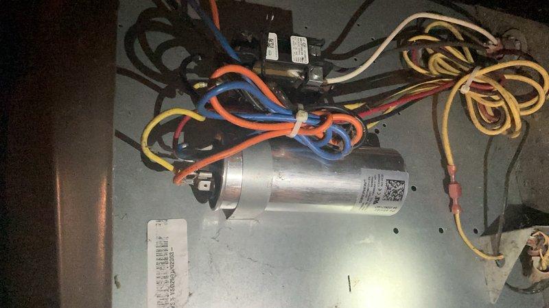 Performed routine maintenance inspection on heat pump system. Accessed internal components and verified proper electrical connections including capacitor, contactors, and control wiring. Inspected condenser fan assembly and confirmed operational status of fan motor and protective guard. All components found in working order with no immediate service needs identified.