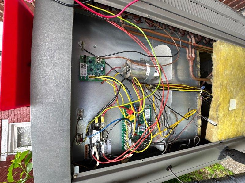 Completed comprehensive preventive maintenance inspection on upstairs air conditioning system. Accessed exterior-mounted condensing unit, removed service panels, and thoroughly inspected all electrical and mechanical components. Verified proper operation of dual control boards, capacitor, and all electrical connections throughout the system. Examined refrigerant line set for proper insulation and signs of wear, noting normal patina on copper tubing consistent with system age. Inspected filter-drier and associated refrigerant piping for corrosion or deterioration. All wiring connections secured and functioning within normal parameters. System components showing typical operational wear with no immediate service needs identified. Unit returned to normal operation following inspection.