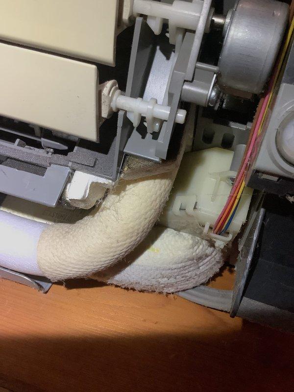 Responded to service call for Daikin ductless mini-split system with four indoor heads. Inspected largest head unit located in dining room with reported louver malfunction. Confirmed horizontal venting option inoperative while vertical positioning remains functional, indicating internal louver gear mechanism failure. Upon opening unit for inspection, discovered significant dust and lint accumulation on internal components and blower assembly, which can contribute to mechanical binding and premature wear of moving parts. System otherwise operating normally with adequate cooling performance. Discussed repair options with customer, including louver motor/gear assembly replacement. Noted unit age at 15-20 years and discussed system obsolescence concerns. Customer aware that replacement parts availability may be limited due to age of equipment. System continues to provide cooling function with vertical airflow direction. Recommended monitoring system performance and provided options for rep