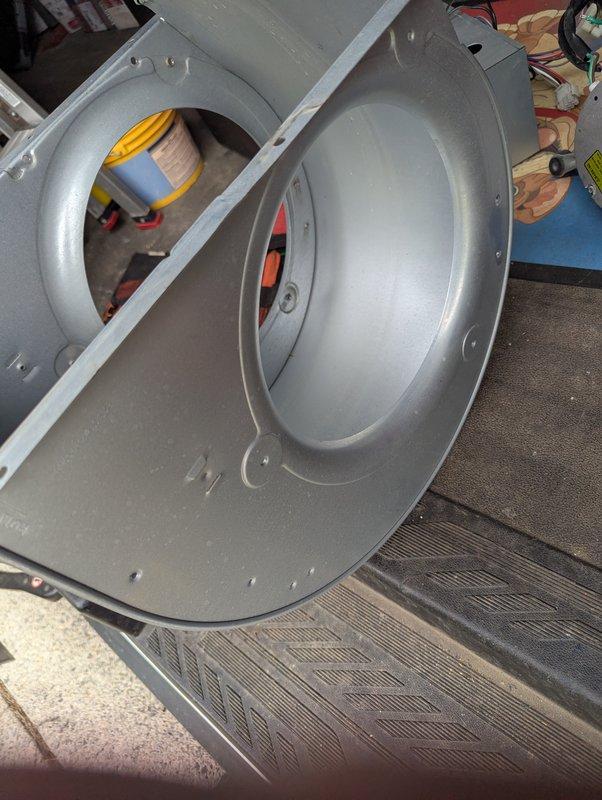 Performed comprehensive coil cleaning and blower wheel cleaning on air conditioning system. Removed and thoroughly cleaned the squirrel cage blower wheel, eliminating accumulated dust and debris from the curved blades and metal surfaces to restore proper airflow efficiency. Cleaned evaporator coil fins to improve heat exchange performance and system cooling capacity.