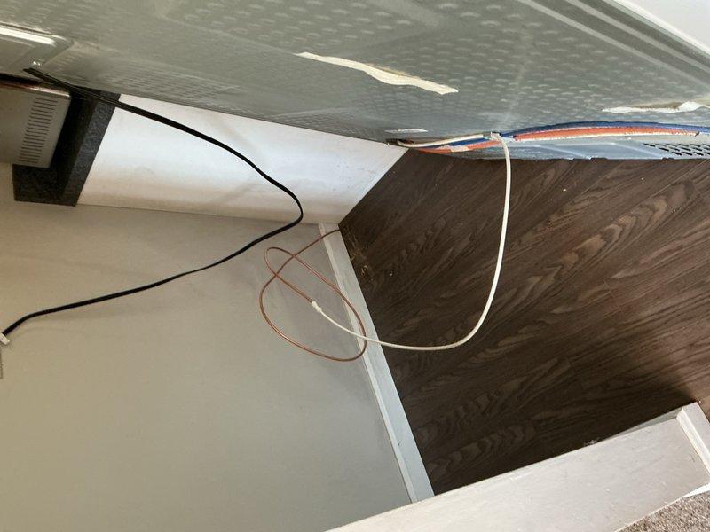 Responded to water leak at refrigerator ice maker supply line. Removed failed piercing valve and deteriorated 1/4" water line. Installed new 1/4 turn stop valve with fresh 1/4" supply line to refrigerator. Tested ice maker operation and verified all connections were leak-free upon completion.
