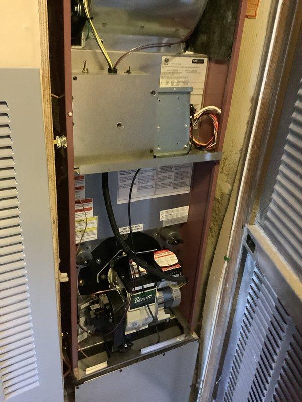Completed full HVAC system changeout including installation of Thermo Pride oil furnace with Beckett burner assembly and Moyer Comfort Series air conditioning condenser unit mounted on concrete pad with 40-foot refrigerant line set. Accessed crawlspace beneath mobile home to replace 10-12 foot section of collapsed 10-inch flex ductwork, connecting new duct run between existing metal 90-degree elbow and intact ductwork penetrating floor membrane using appropriate couplings. Verified airflow to all bedroom supplies and confirmed proper system operation upon completion.