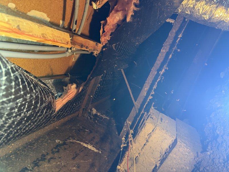 Responded to cold water leak under mobile home where crimped tee fitting was identified as the source of the leak. Replaced leaking polybutylene tubing with PEX piping for both hot and cold water lines in the crawl space. Water had been shut off to the home prior to arrival and was restored upon completion of repairs.