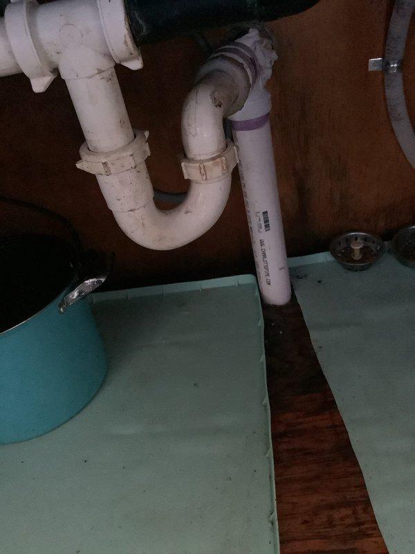 Responded to clogged kitchen sink drain that was initially slow-draining before becoming completely blocked. Customer had disposed of large quantity of rice through garbage disposal, which does not break down and caused the obstruction. Attempted to clear blockage using plunger and chemical drain cleaner without success. Inspected sink basin, drain assembly, and P-trap configuration beneath sink. Due to severity of blockage and unsuccessful initial clearing attempts, additional service scheduling required to properly address obstruction with appropriate equipment and techniques.