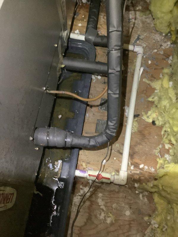 Responded to condensate leak from attic air handler causing ceiling water damage. Inspected drainage system and confirmed air handler was producing proper cooling after previous refrigerant charge. Identified condensate drain line issue causing overflow into living space. Cleared blockage from condensate drain line and verified proper drainage flow from air handler drain pan. System tested and confirmed operational with no further leakage detected.