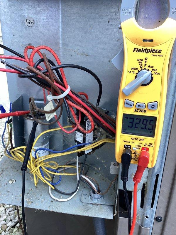 Completed comprehensive maintenance inspection on 3-year-old heat pump system. Performed electrical diagnostics using clamp meter on indoor air handler unit, measuring blower motor amperage at 5.92 amps, confirming proper operation within manufacturer specifications. Proceeded to outdoor condensing unit where capacitor testing was conducted, measuring 3299 microfarads to verify component integrity and starting capabilities. All electrical connections inspected and found secure, system operating efficiently with no issues identified.