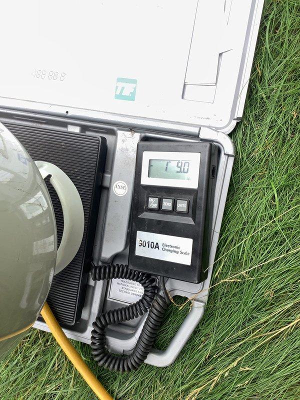 Responded to no cooling complaint on 410A residential system with frozen evaporator coil. Found indoor coil iced over with circulation fan running but compressor off. Allowed system to thaw completely, then performed leak check and system diagnostics. Identified refrigerant loss as primary cause of freeze condition. Evacuated remaining refrigerant, performed vacuum test to verify system integrity, and recharged system to manufacturer specifications using calibrated electronic charging scale. Verified proper airflow, confirmed filter had been recently replaced, and tested system operation with normal temperature differential and no freeze-up upon restart.