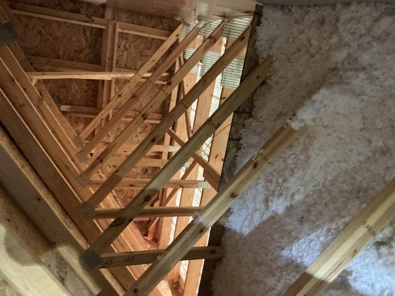 Serviced multi-zone HVAC system by installing and wiring zone damper control panel with multiple zone modules and thermostat connections. Verified proper operation of all zone dampers and confirmed system functionality in attic installation area.