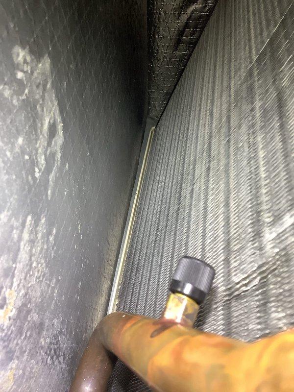 Responded to low refrigerant call and added 1.9 lbs of R-410A refrigerant along with UV dye to system. Upon follow-up inspection, UV dye successfully identified active leak at lineset connection point, confirming refrigerant loss and need for repair.