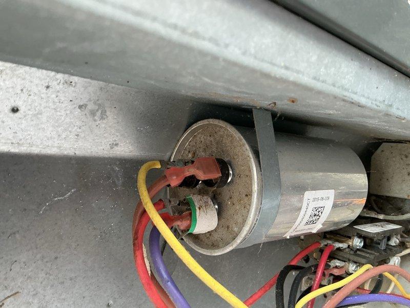 Responded to no cooling complaint on 3-4 year old Goodman system. Upon inspection, found rusted sight glass and failed capacitor preventing compressor operation. Replaced defective dual run capacitor with proper replacement rated for unit specifications. Verified all electrical connections secure, tested system operation, and confirmed unit now cooling properly with normal amperage draws and temperature split across evaporator coil.