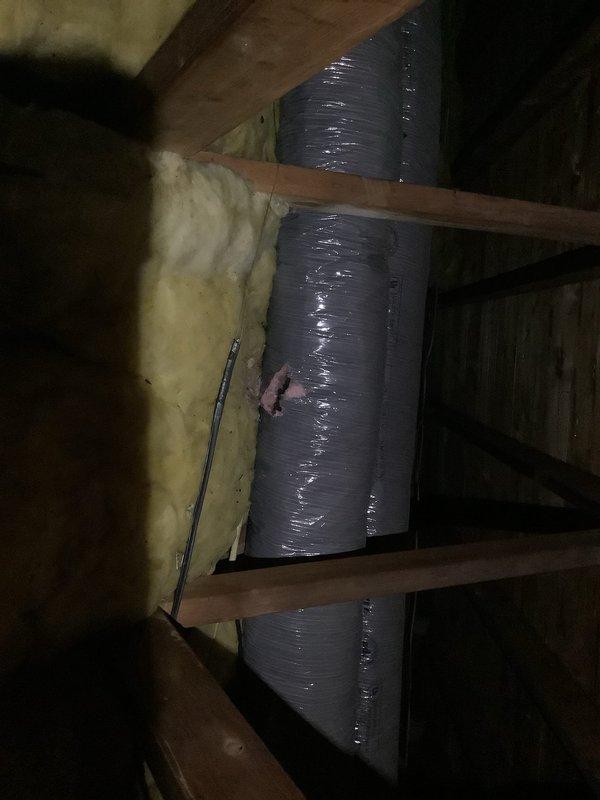 Responded to follow-up service call for cooling performance verification after recent after-hours assistance. Performed comprehensive system inspection of upstairs air conditioning unit. Conducted visual examination of exterior condensing unit and interior air handler components, including ductwork and insulation integrity in attic space. Verified system operation, airflow, and cooling output. Documented equipment condition with photographs showing exterior unit installation, electrical connections, and attic ductwork routing. System confirmed operational with adequate cooling capacity. Advised on proper filter maintenance for upstairs unit.