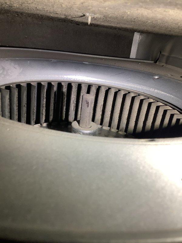 Responded to no cooling complaint with outdoor fan motor failure. Found indoor blower assembly operational but outdoor condensing unit fan not running, preventing heat rejection and causing indoor temperature rise. Inspected evaporator coil area showing normal operation of air handler components. Observed significant condensation on refrigerant lines indicating system had been attempting to operate. Diagnosed failed outdoor fan motor preventing condenser unit operation, resulting in loss of cooling capacity.