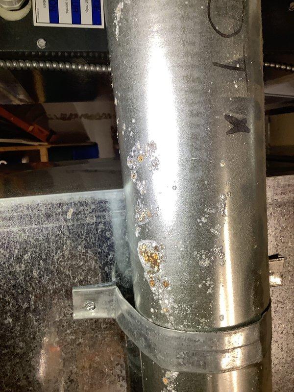 Responded to no cooling complaint with outdoor fan motor failure. Found indoor blower assembly operational but outdoor condensing unit fan not running, preventing heat rejection and causing indoor temperature rise. Inspected evaporator coil area showing normal operation of air handler components. Observed significant condensation on refrigerant lines indicating system had been attempting to operate. Diagnosed failed outdoor fan motor preventing condenser unit operation, resulting in loss of cooling capacity.