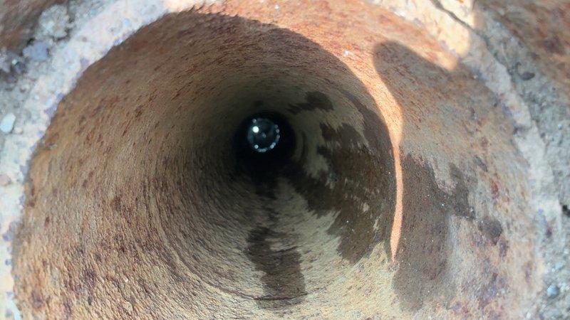 Responded to main sewer line backup causing complete drainage failure throughout the property. Upon inspection, discovered severely corroded cast iron drain pipe with extensive rust buildup and deterioration restricting flow. Cleared the blockage and restored proper drainage function, allowing all plumbing fixtures to operate normally without backup issues.