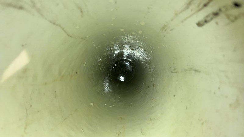 Responded to main sewer line backup causing complete drainage failure throughout the property. Upon inspection, discovered severely corroded cast iron drain pipe with extensive rust buildup and deterioration restricting flow. Cleared the blockage and restored proper drainage function, allowing all plumbing fixtures to operate normally without backup issues.
