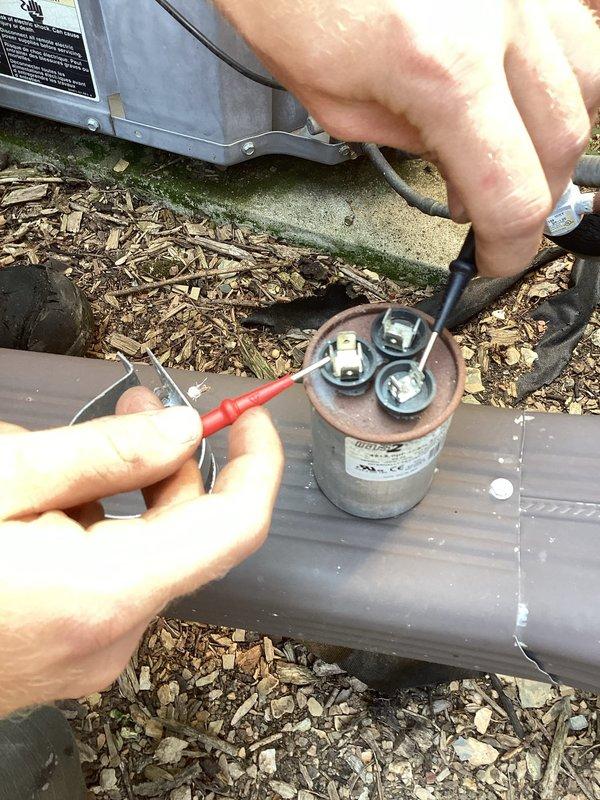 Responded to no cooling complaint with indoor temperature at 83 degrees and system blowing warm air. Replaced batteries in thermostat and performed diagnostic testing on outdoor condensing unit. Used clamp meter to measure electrical readings and inspected capacitor connections. System was turned off after initial assessment, and customer was scheduled for Monday appointment after determining parts or additional service would be required.
