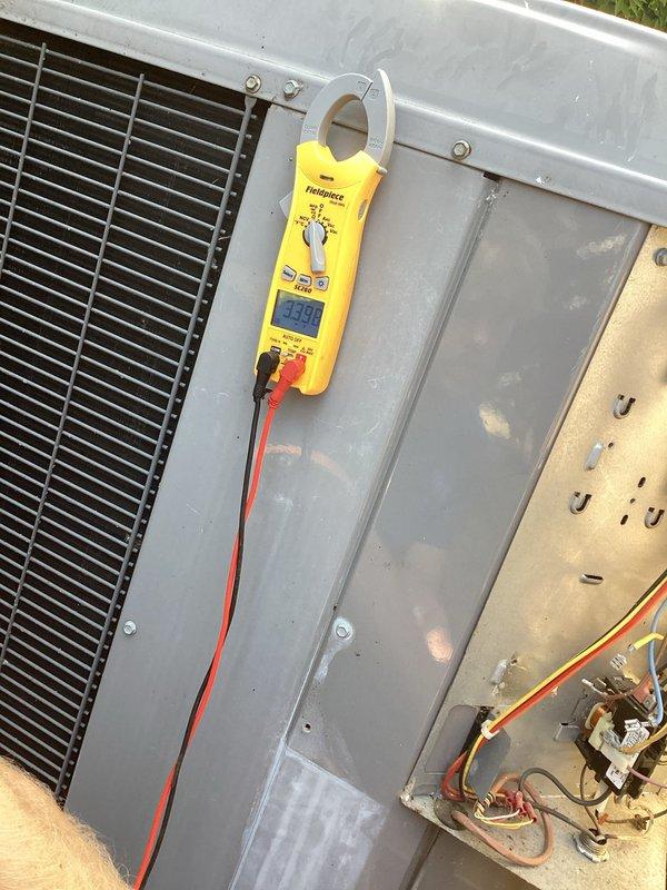 Responded to no cooling complaint with indoor temperature at 83 degrees and system blowing warm air. Replaced batteries in thermostat and performed diagnostic testing on outdoor condensing unit. Used clamp meter to measure electrical readings and inspected capacitor connections. System was turned off after initial assessment, and customer was scheduled for Monday appointment after determining parts or additional service would be required.