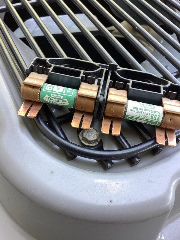 Responded to service call for residential air conditioning system blowing warm air with inadequate cooling performance. Upon inspection, identified issues with refrigerant line connections and electrical wiring at outdoor condenser unit. Secured copper refrigerant lines in mounting bracket with proper insulation sleeves to prevent thermal loss. Verified and reconnected electrical connections at junction box using appropriate wire connectors to ensure proper power supply to compressor and condenser fan motor. Tested system operation and confirmed proper cooling function restored with adequate airflow and temperature differential.