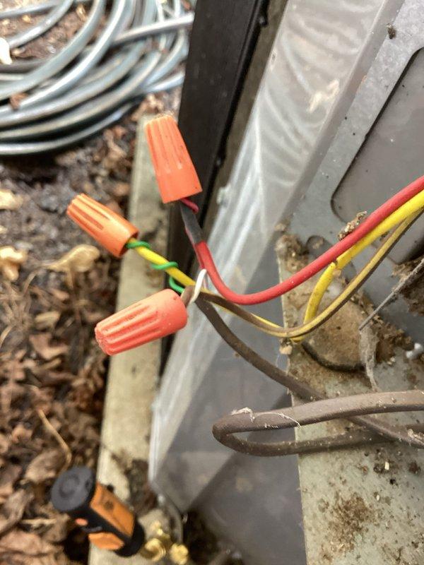 Responded to service call for residential air conditioning system blowing warm air with inadequate cooling performance. Upon inspection, identified issues with refrigerant line connections and electrical wiring at outdoor condenser unit. Secured copper refrigerant lines in mounting bracket with proper insulation sleeves to prevent thermal loss. Verified and reconnected electrical connections at junction box using appropriate wire connectors to ensure proper power supply to compressor and condenser fan motor. Tested system operation and confirmed proper cooling function restored with adequate airflow and temperature differential.