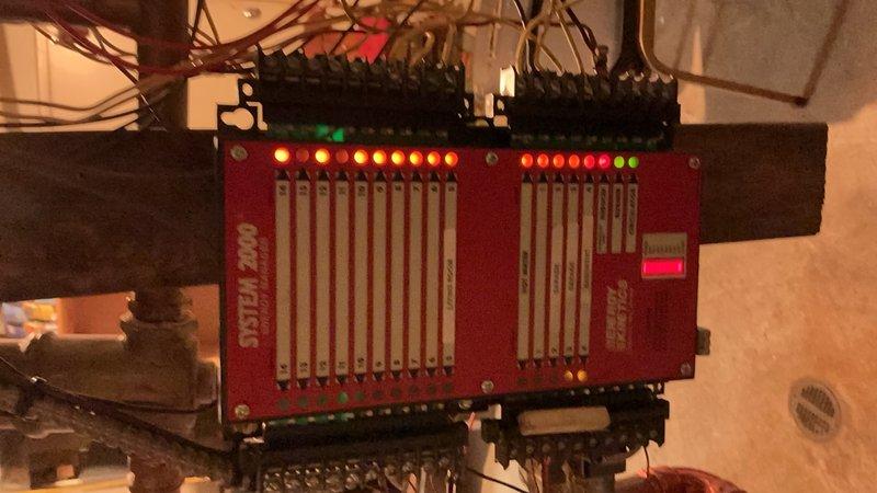 Replaced malfunctioning System 2000 zone valve control board that was experiencing buzzing and displaying multiple fault indicators. New board was installed and tested, with all zones now operating properly and system functioning as designed.