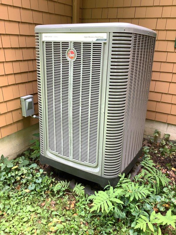 Completed comprehensive preventative maintenance inspection on Rheem heat pump system (installed January 2017). Performed full system evaluation including thermostat operation verification, electrical voltage and amperage measurements, blower wheel inspection, indoor coil assessment, condenser component examination, and refrigerant leak check. Recorded return air temperature of 73°F and supply air temperature of 52°F, confirming proper 17°F temperature split. Replaced air filter with 20x20 MPG filter. All system components operating within normal parameters with no deficiencies noted.