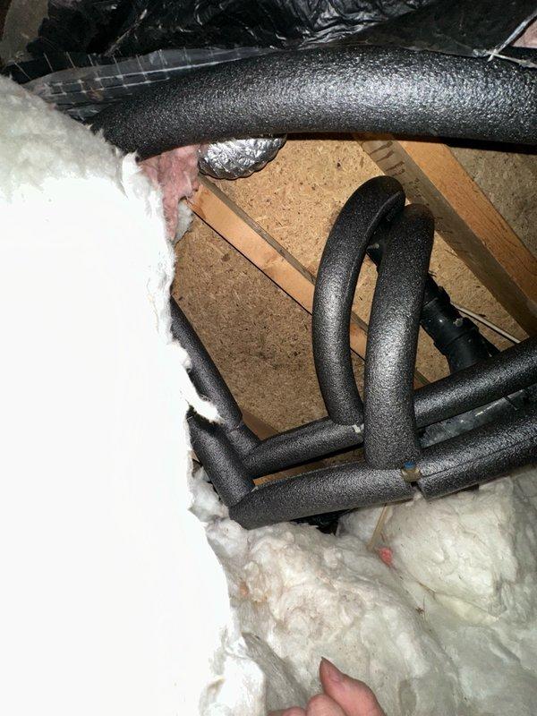Replaced deteriorated heat tape and dryer venting system in attic crawl space. Removed existing foam-insulated piping and flexible metallic duct work, installing new code-compliant dryer venting with proper routing and support. Coordinated with Green-Tech insulation contractor for removal and replacement of fiberglass insulation to access work areas. Additional pipe replacement options were identified and documented for separate approval consideration.