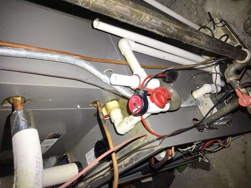 Completed comprehensive preventive maintenance inspection on residential air conditioning system installed in December 2019. Performed thorough examination of indoor air handler components including blower motor assembly, electrical connections, control board, and wiring harnesses. Verified all wire connections were properly secured with zip ties and showed no signs of overheating or deterioration. Inspected cylindrical blower motor and mounting brackets for proper operation and structural integrity. Examined control board for any signs of component failure, loose connections, or burnt circuits - all found to be in good working condition. Checked air filter condition and airflow. Inspected outdoor condensing unit including refrigerant lines, shut-off valves, and plumbing connections. Verified red shut-off valve operation and checked all copper and PVC piping for leaks or damage. All mechanical and electrical components functioning within normal parameters. System operational.