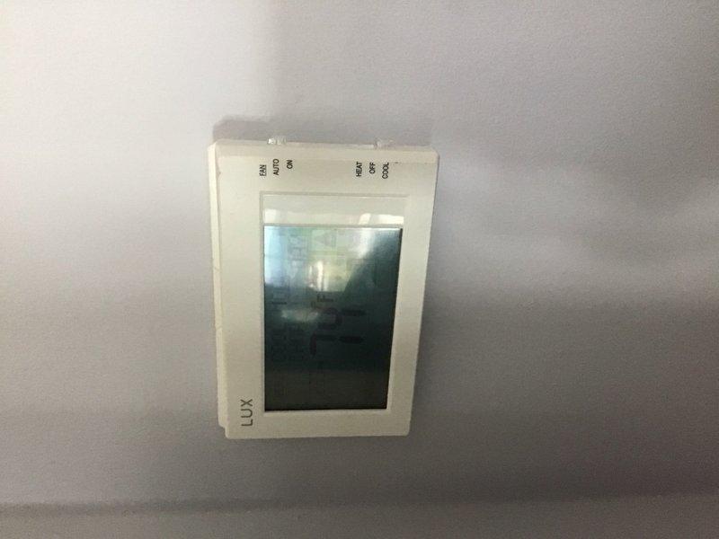 Responded to service call for multiple HVAC units with two units reported non-operational. Inspected five-unit system and documented all equipment specifications and filter sizes for record updates. Casino room unit found running but producing warm air only; inspected and documented 20x20x5 air filter (Honeywell FC100A1011 replacement style). Guest area unit below casino room completely non-operational with thermostat displaying blank screen, indicating possible power supply issue or battery failure requiring further diagnosis. Assessed LUX thermostat and documented conditions. Membership program discussed with property owner who expressed interest in ongoing maintenance services.
