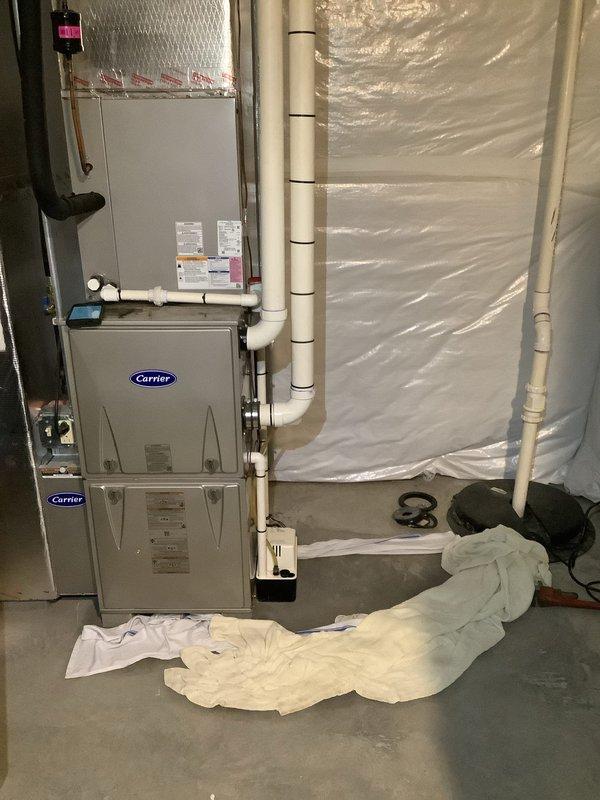 Responded to service call for frozen evaporator coil with water accumulation at indoor unit. Instructed customer to power off system, remove air filter, and set fan to continuous ON position to facilitate thawing overnight. Added leak search UV dye to refrigerant system to identify potential leak sources causing low refrigerant charge and subsequent coil freeze-up. Connected refrigerant manifold gauges to system and recorded operating pressures and temperatures for diagnostic analysis. Provided membership program information via email for ongoing preventative maintenance. Advised customer on proper restart procedures and monitoring protocol, including instructions to repeat thaw process if freezing recurs before follow-up service can be scheduled.