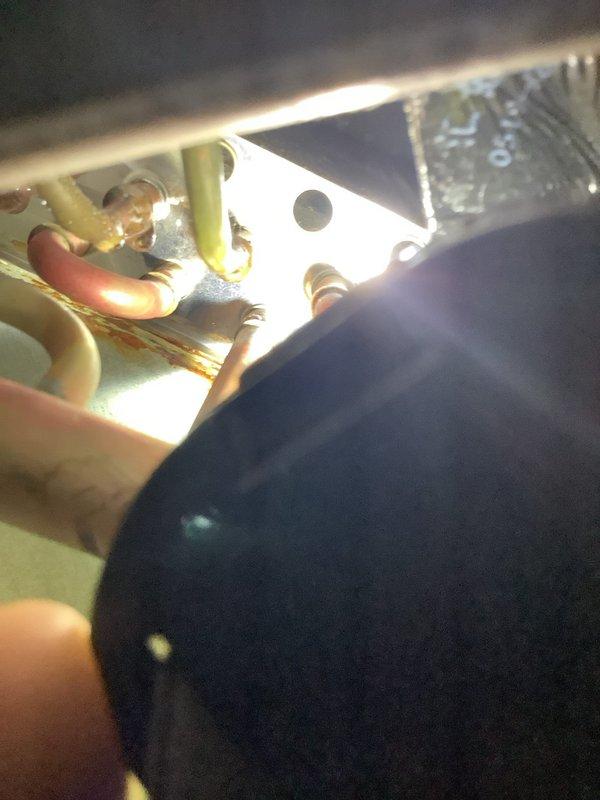 Performed comprehensive tune-up and maintenance on Samsung mini-split system installed in June 2017, confirming unit is operating without issues. Inspected and documented deteriorated refrigeration line insulation that was falling off in pieces along the exterior wall run, with exposed copper lines visible through damaged insulation sections. Evaluated electrical connections, capacitor, and terminal block inside equipment enclosure, verifying all wiring connections are secure and components are functioning properly.