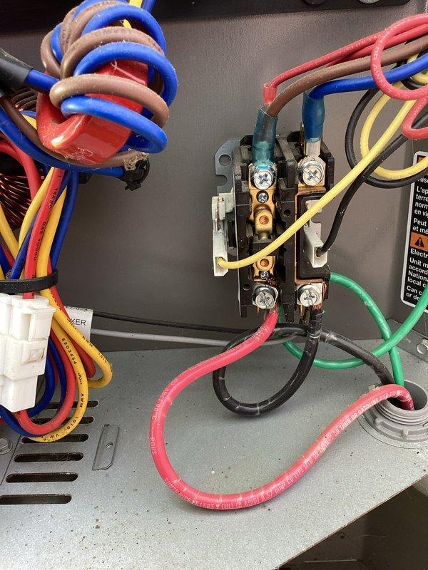 Performed air conditioning system check and provided thermostat operation education for new homeowner. Conducted electrical diagnostics on HVAC control panel, verified 24-volt control circuit operation reading 24.45 volts, and inspected all wire connections and terminal blocks for proper function. System found operating within normal parameters.