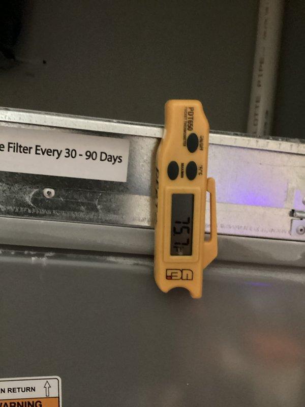 Installed and wired NEST thermostat in new residential construction to establish proper communication with air conditioning system. Verified system operation with airflow measurements at supply register reading 2985 CFM and confirmed proper temperature control functionality at air handler unit.