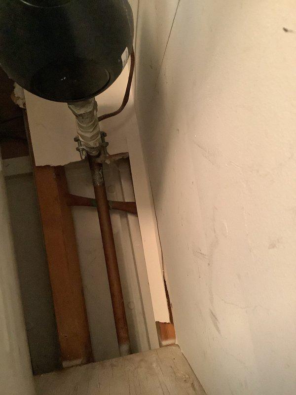 Coordinated with water company for street-side water shutoff at 8:00 AM to facilitate replacement of defective street-side valve. Replaced toilet in main warehouse facility and completed miscellaneous plumbing repairs. Inspected and documented water heater installation connections including copper piping, PEX tubing, ball valves, and pressure tank components to ensure proper operation following water service restoration.